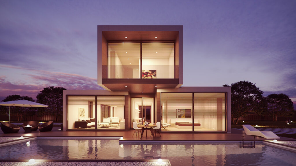 Abbildung: Ein modernes Haus mit einem Pool vorne, erleuchtet im Nachtlicht